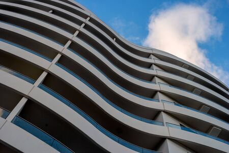 Tallinn, Estonia - January 4, 2020: Wall of a modern building with curved balconies. Abstract picture for background.のeditorial素材