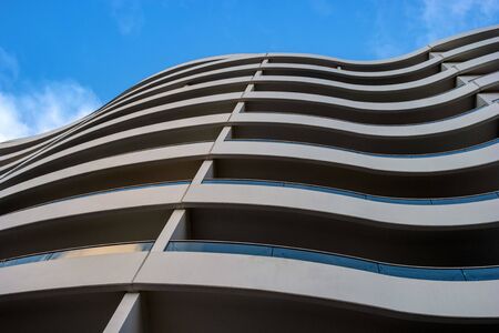 Tallinn, Estonia - January 4, 2020: Wall of a modern building with curved balconies. Abstract picture for background.のeditorial素材