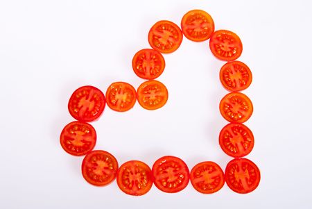 Heart of the tomatoes on a white background.の写真素材