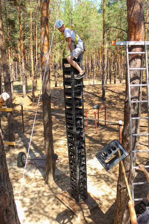 Young Man Climbs High Extreme wideの写真素材