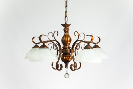 Chandelier vintage bronze with white plafonds on the gray backgroundの写真素材