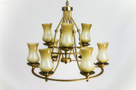 Chandelier golden color with beige plafondsの写真素材