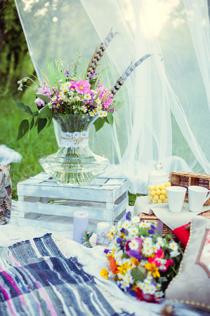 bouquet of flowers in a glass vase in natureの写真素材