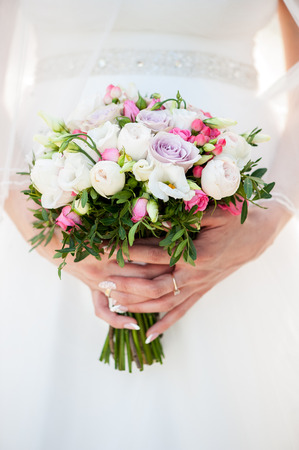 wedding bouquet in bride's handsの写真素材