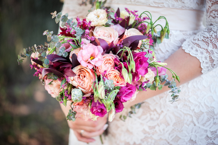 wedding bouquet in bride's handsの写真素材