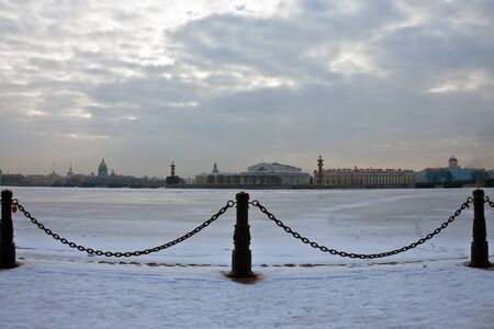 View of the historic centre and the river Neva in St. Petersburg. The building of stock Exchange, Kunstkamera, St. Isaac Cathedral, Rostral column in winter.の写真素材