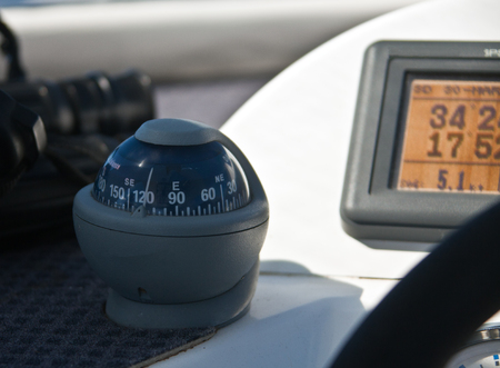 Sea compass on a modern yacht. Electronic means of navigation.