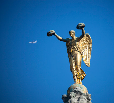 Goddess of Victory with laurel wreaths and airplane profile. Monument to the Victory Goddess of the sculptor Louis Simon Bouazon column of the Palm Fountain in Paris.の写真素材