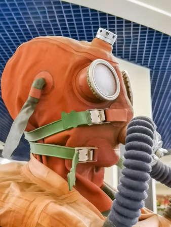 Hypertrophied protective equipment for the face, eyes, lungs and body during the pandemic. Protective rubber set of clothing with air purification system for breathing.の写真素材