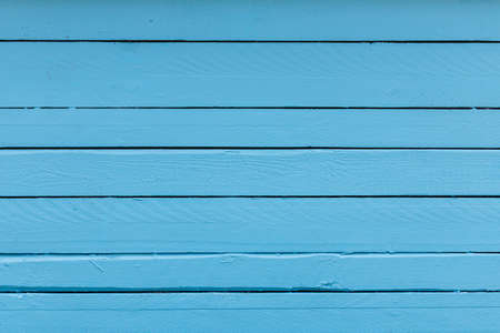 High resolution cracked wood planks, painted with thik blue color.の写真素材