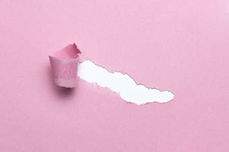Breach or peeled of paper for hidden text used as template or mockup on pink natural paper, use for compositions and easy to colorの写真素材
