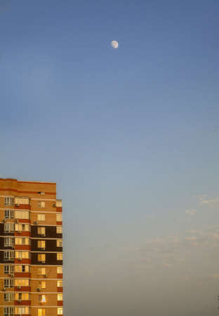 high-rise city building at sunset, against the background of the evening sky.の写真素材