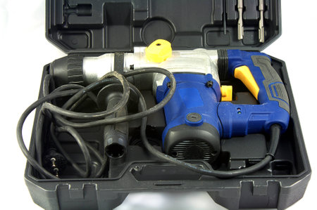 Suitcase with driller isolate on white background