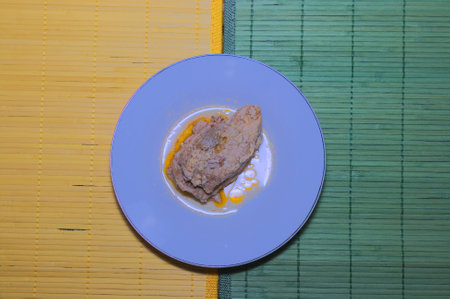  Rig of meat in sauce on plate の写真素材