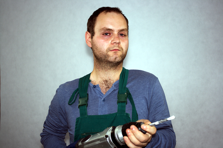 Man of worker and hammer drill の写真素材
