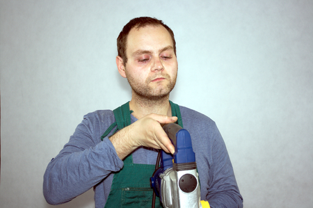 Man of worker and hammer drill の写真素材