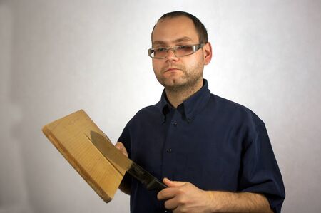 Man with kitchen accessories on whiteの写真素材