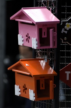 Red and Pink postbox which are sold for decorating