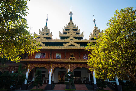 One of the impressive buildings of Wang Wiwekaram temple in Sangkhla Buri, lovely surrounded by a green garden.の写真素材
