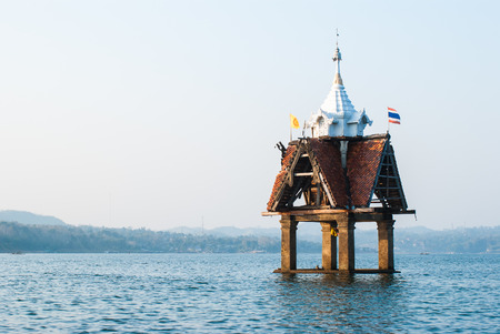 Small pagoda in the river at Sangklaburi, Kanchanaburi, Thailandの写真素材
