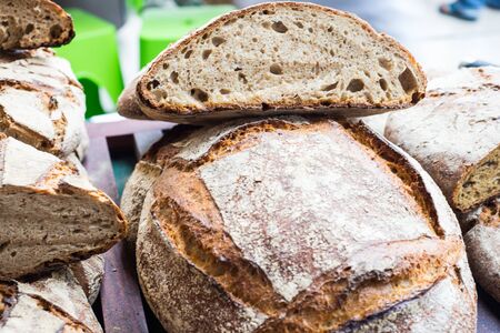 Texture of homemade bread on wooden plate, healthy eatingの写真素材