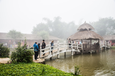 Maehongson, Thailand - December 10, 2016: Tourists taking pictures on the bridge at Santichon or Yunnan cultural villegeのeditorial素材