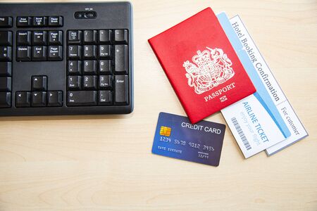 Travel concept, Travellers accessories for travelling around the world on summer vacation or long holiday such as passport, airline ticket, hotel booking confirmation and credit cardの写真素材