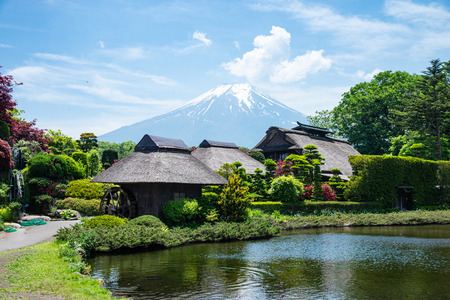 Beautiful Fuji mountain with cloud and blue sky  in the summer at Oshino Hakkai the old Japanese village, the famous landmark and attraction place of tourists who have a long holiday in Japanのeditorial素材