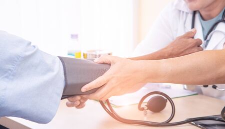 Healthcare and medical concept. Asian professional woman doctor with medical equipment measuring...