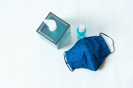 Coronavirus  or COVID-19 protection concept fabric or hygiene mask hand sanitizer gel and algohol...