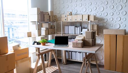 Equipments for SME online business , delivery business laptop, barcode, boxes, checking product on stocks or parcels. Small business working at home office.の写真素材