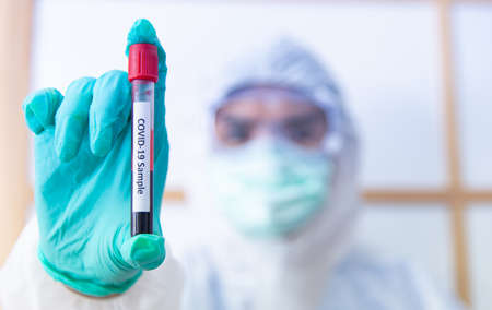 COVID-19, Corona Virus vaccine research and development concept. Blur Asian scientist showing...