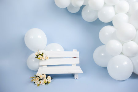 wooden bench, balloons birthday party decorationsの写真素材