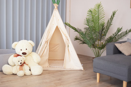 children's area with tent, dry pool and large toys in the living room. children's room in an office,...