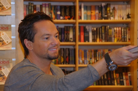 Andreas Carlsson from the Swedish Idol 2010 Jury signs copies of his new book Dandy at the book store Akademibokhandeln on November 20, 2010 in Karlstad, Swedenのeditorial素材