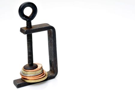 Squeeze on moneyの写真素材