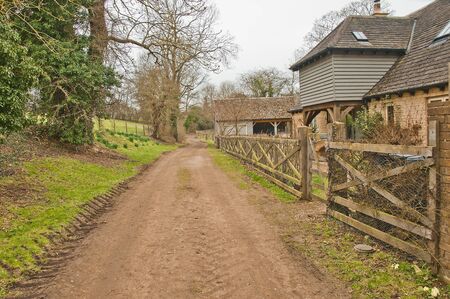 Country path past buildingsのeditorial素材