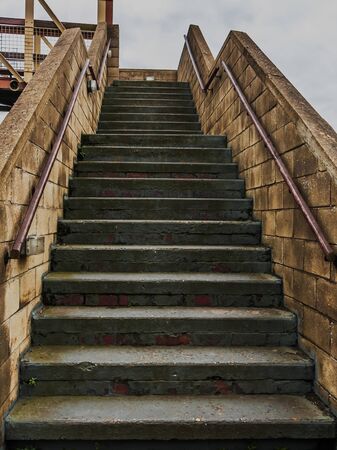 Concrete steps over a railway bridge