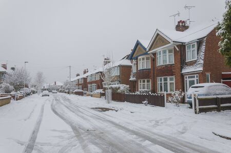 Snow and ice on an urban city road in the Winterのeditorial素材