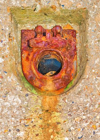 Rusty old drain outletの写真素材