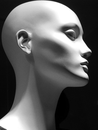Black and white image of a white mannequin head PROFILE on a black backgroundの写真素材