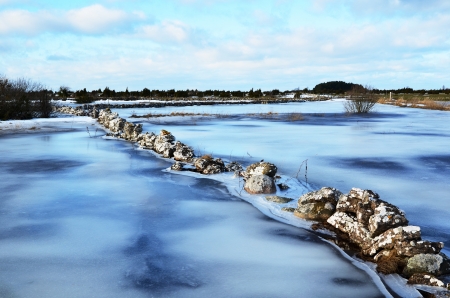 Stonewall at ice covered floodの写真素材