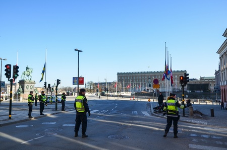 Swedish policemen in front of the Royal Palace in Stockholm at the turkish state visit in march 2013のeditorial素材