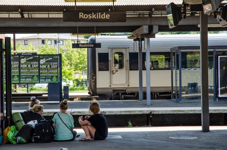 Some young people waiting for train at Roskilde train station to take them home after Roskilde Music Festivalのeditorial素材