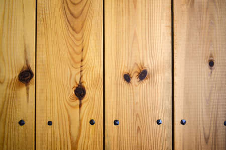 Wooden panel background with wrought iron nailsの写真素材
