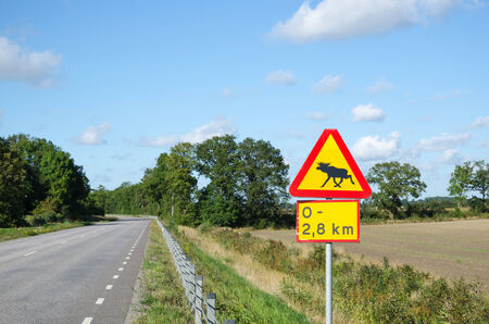 Moose warning roadsign in a rural swedish landscapeの写真素材