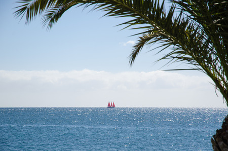 Yacht by the tropical coast of the Canary Islands in Spainの写真素材