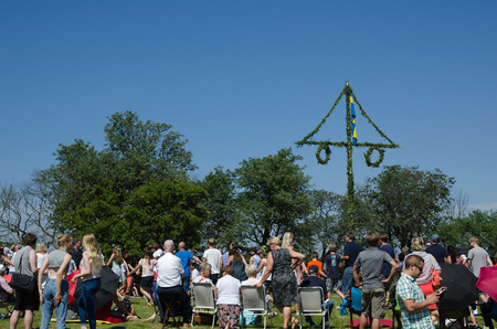 Borgholm, Oland, Sweden - June 24, 2016: People has gathered for celebrating midsummer by a maypole in Swedenのeditorial素材