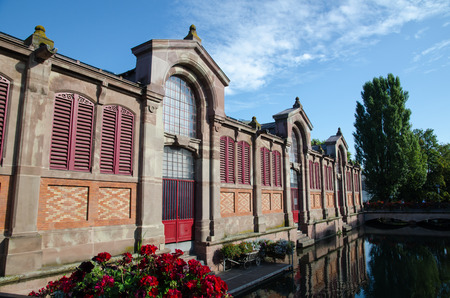 Colmar, France - September 12, 2016: The market hall by the river La Lauch in the city Colmar in Franceのeditorial素材