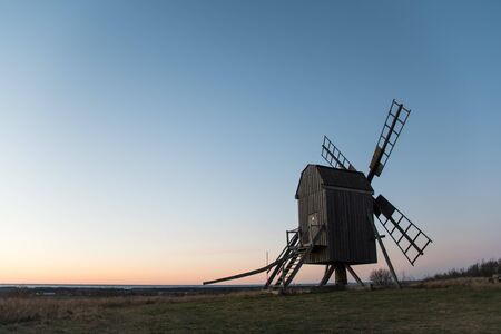 Old traditional windmill in evening light at the swedish island Oland in the Baltic Seaの写真素材